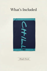 Navy blue towel with 'CHILL!' in turquoise on a beach with ocean and palm tree in the background