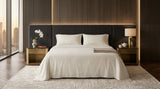 Cotton bed sheet set from the Core Collection featuring breathable cotton comfort, decorative cushion covers, and elegant everyday bedroom styling
