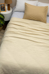  Elenor Coverlet  on a bed with pillows in a bedroom setting