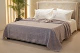 Textured 100% cotton coverlet from the Textures Collection featuring breathable comfort, layered texture, and modern luxury bedroom styling