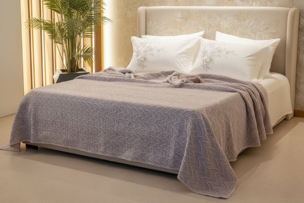 Textured 100% cotton coverlet from the Textures Collection featuring breathable comfort, layered texture, and modern luxury bedroom styling
