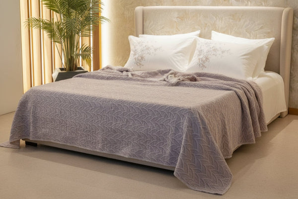 Textured 100% cotton coverlet from the Textures Collection featuring breathable comfort, layered texture, and modern luxury bedroom styling